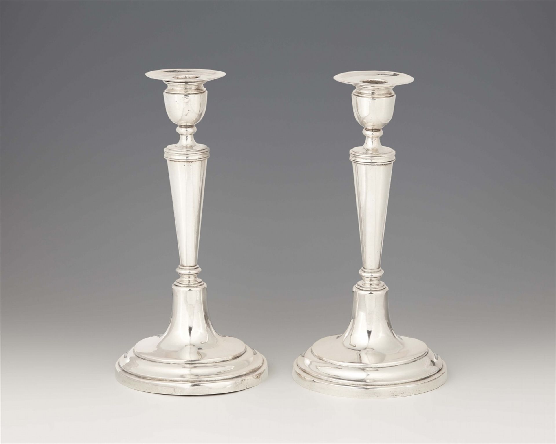 A pair of Warsaw silver candlesticks