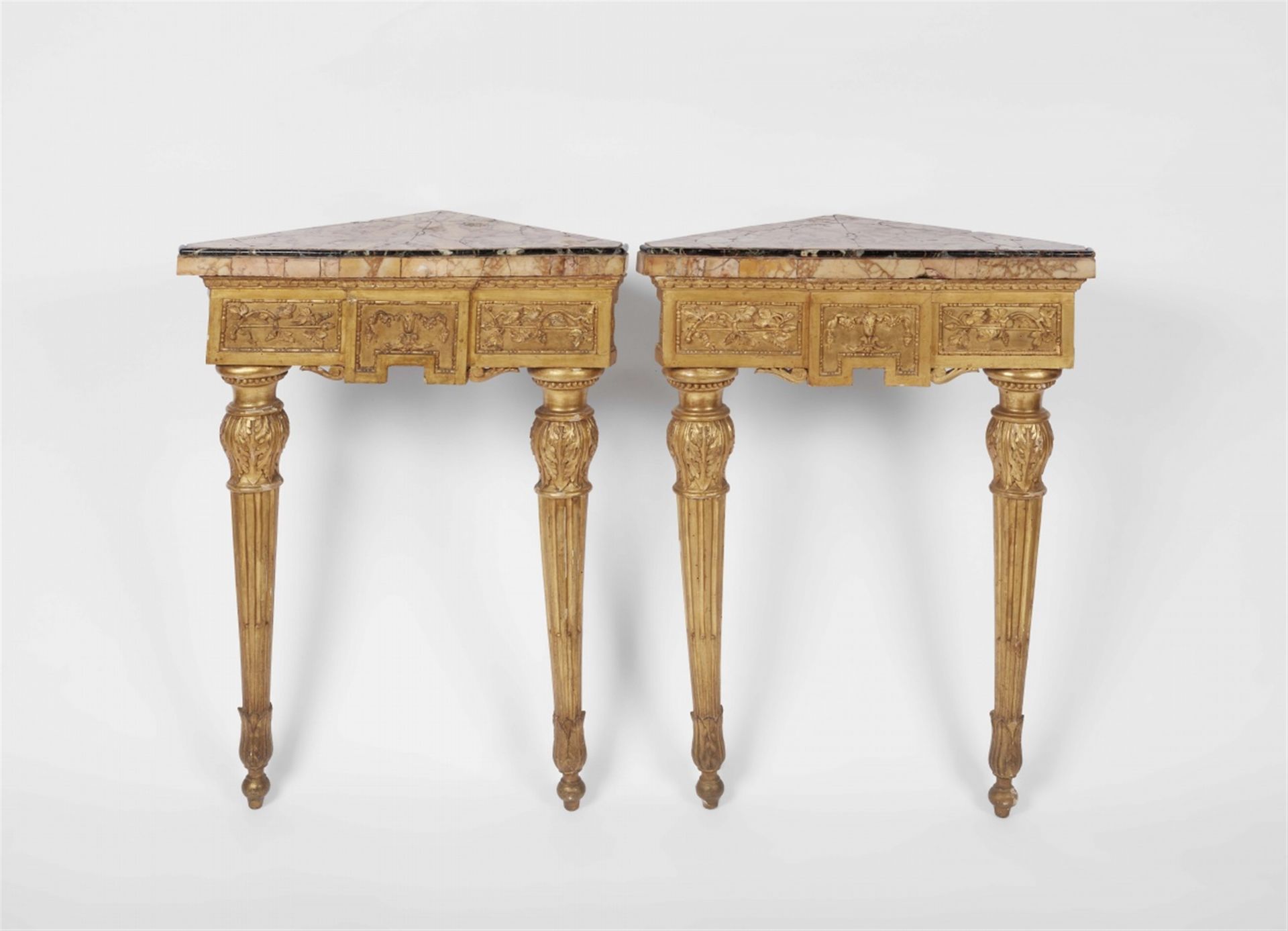 A pair of Neoclassical Italian giltwood corner tables