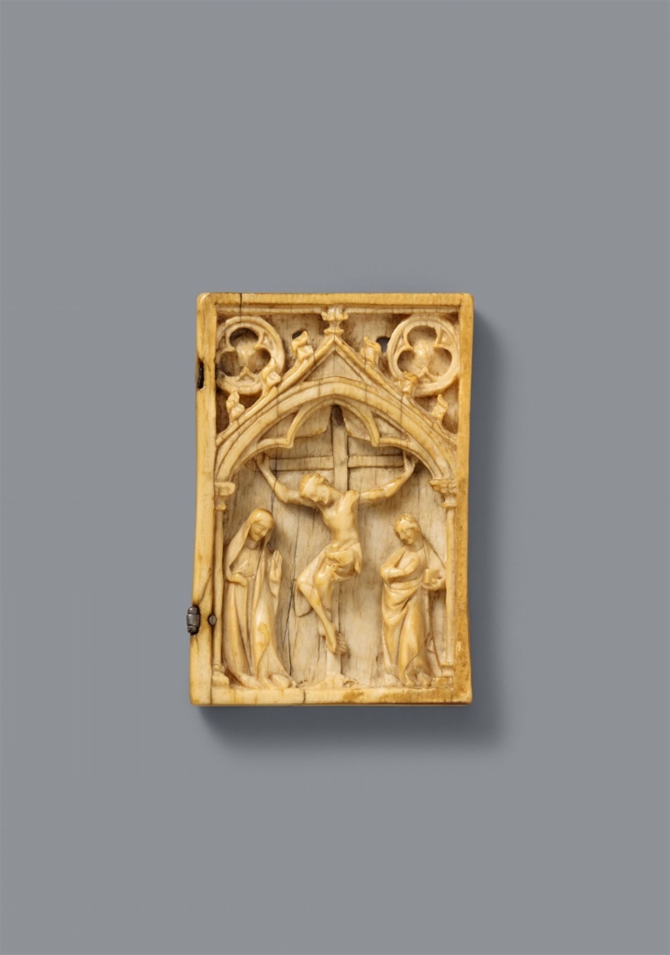 A French carved ivory relief of the Crucifixion, second half 14th century