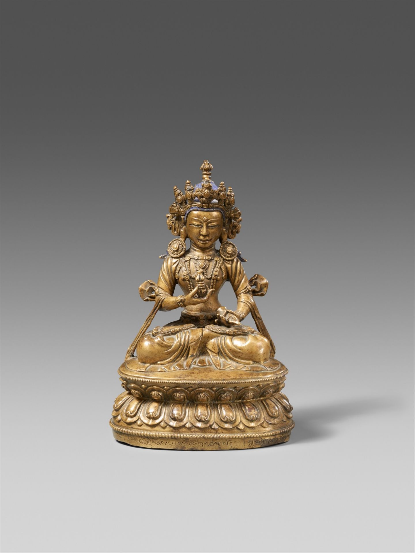 An important Tibetan bronze figure of Vajrasattva with inscription to the base. 15th/16th century