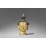 Kopf eines Bodhisattva. Kupfer-Repoussé, vergoldet. Tibet. 18./19. Jh.