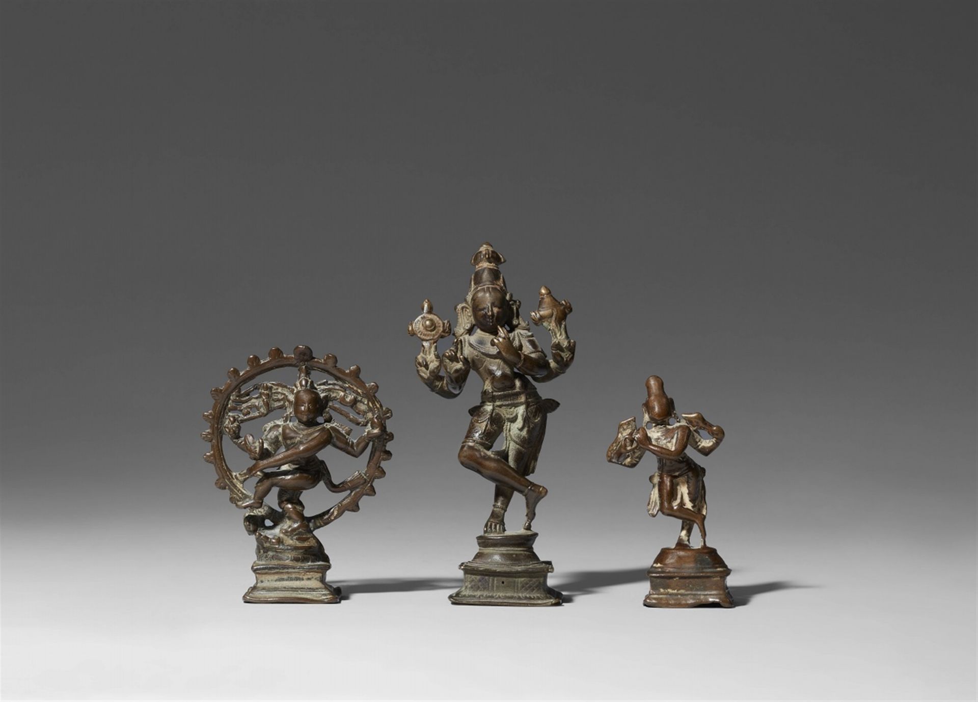 Three small copper alloy figures of a dancing deity. 17th/19th century