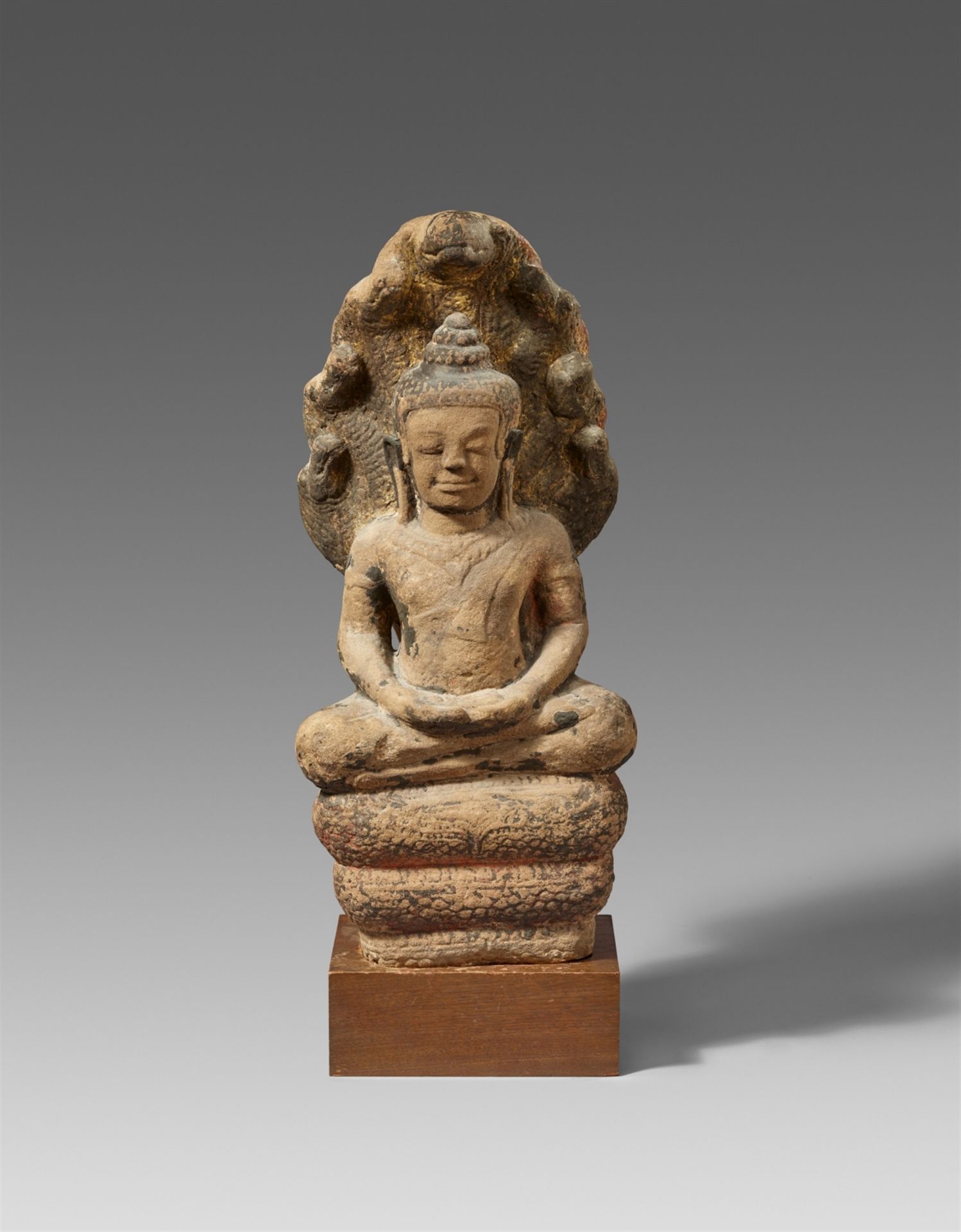 A Lopburi sandstone figure of Buddha Mukhalinda. Thailand. 13th century