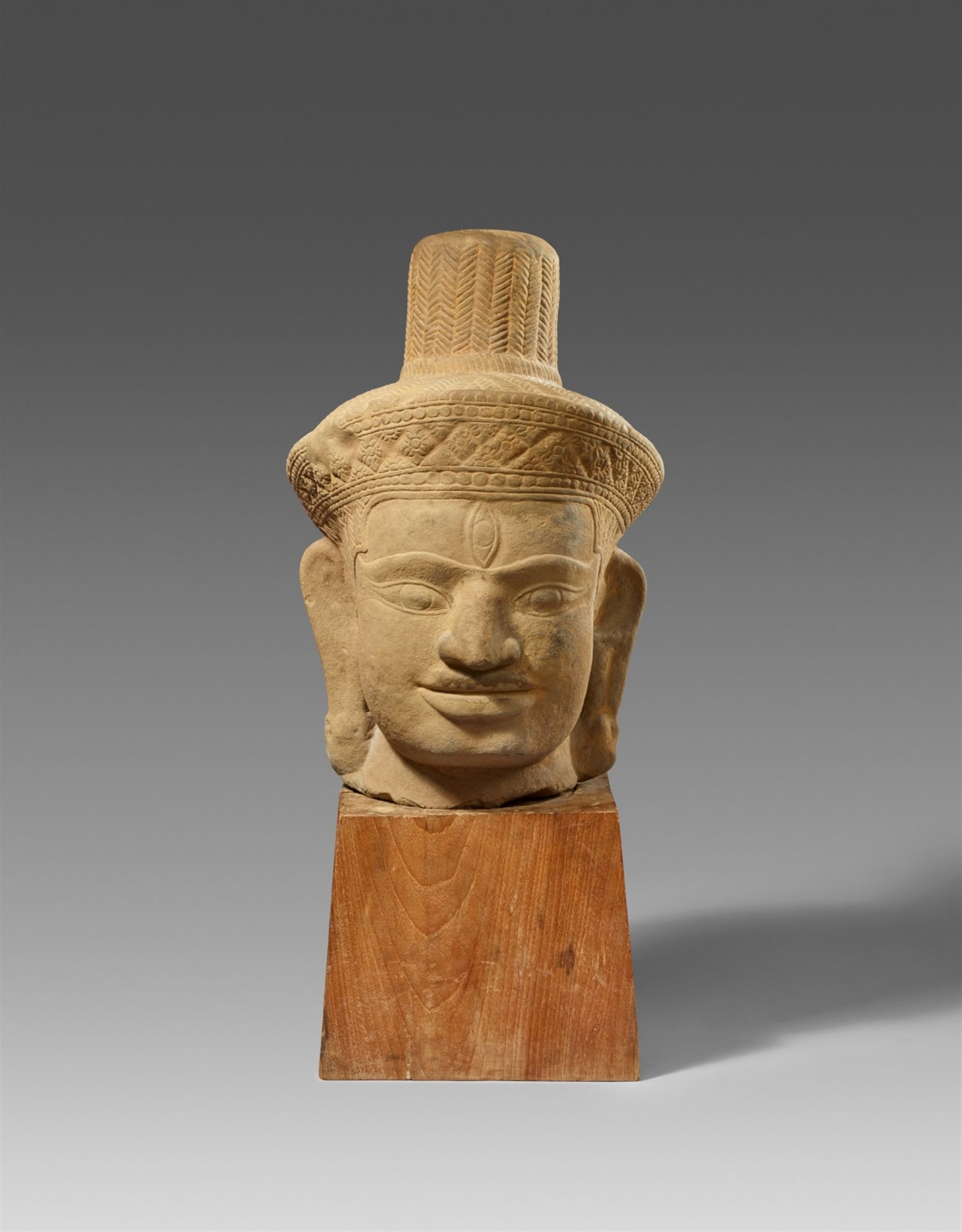 A very large Cambodian sandstone head of Shiva. 10th century or later