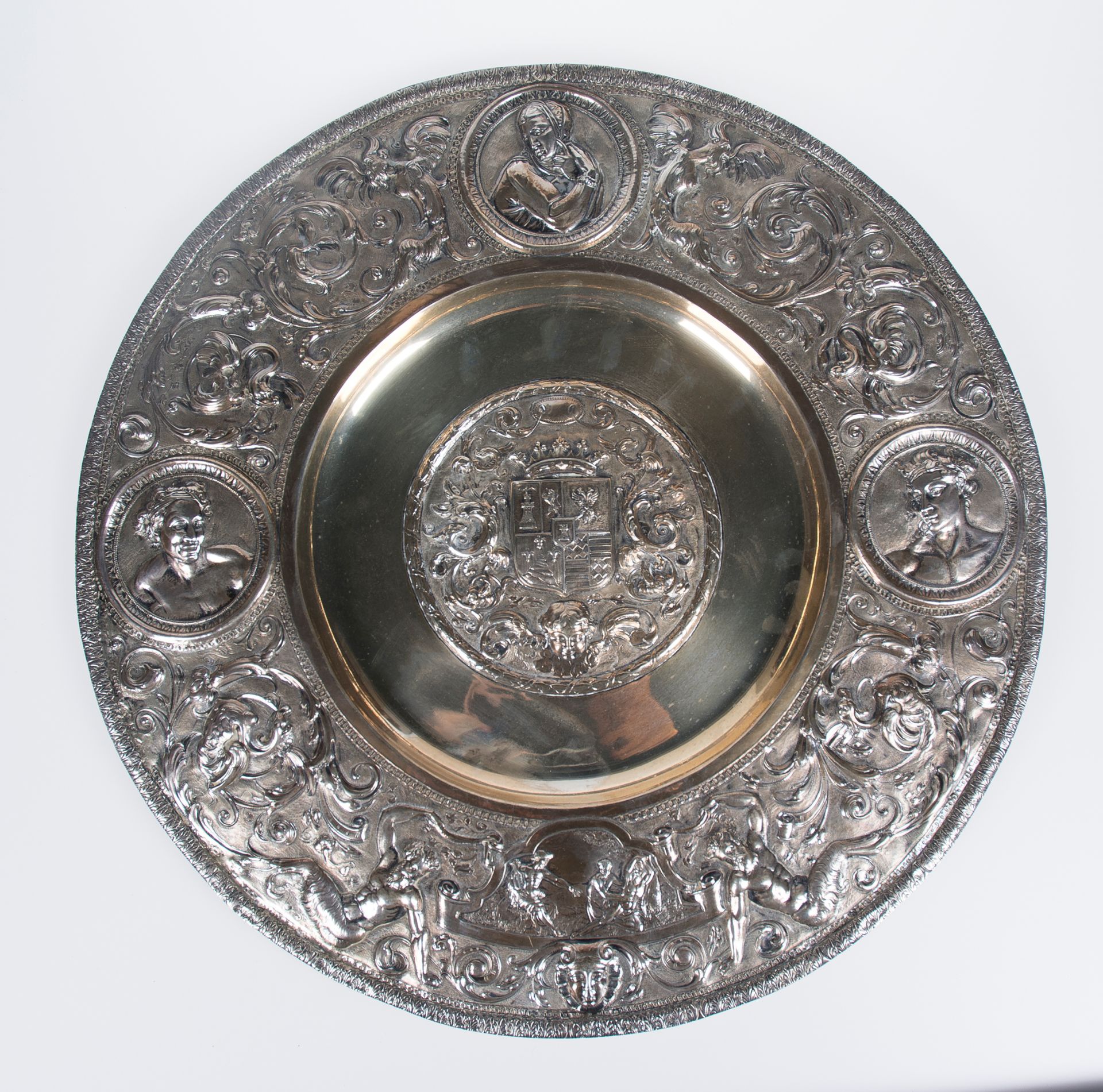 Large, embossed and chased silver plate. 19th century.