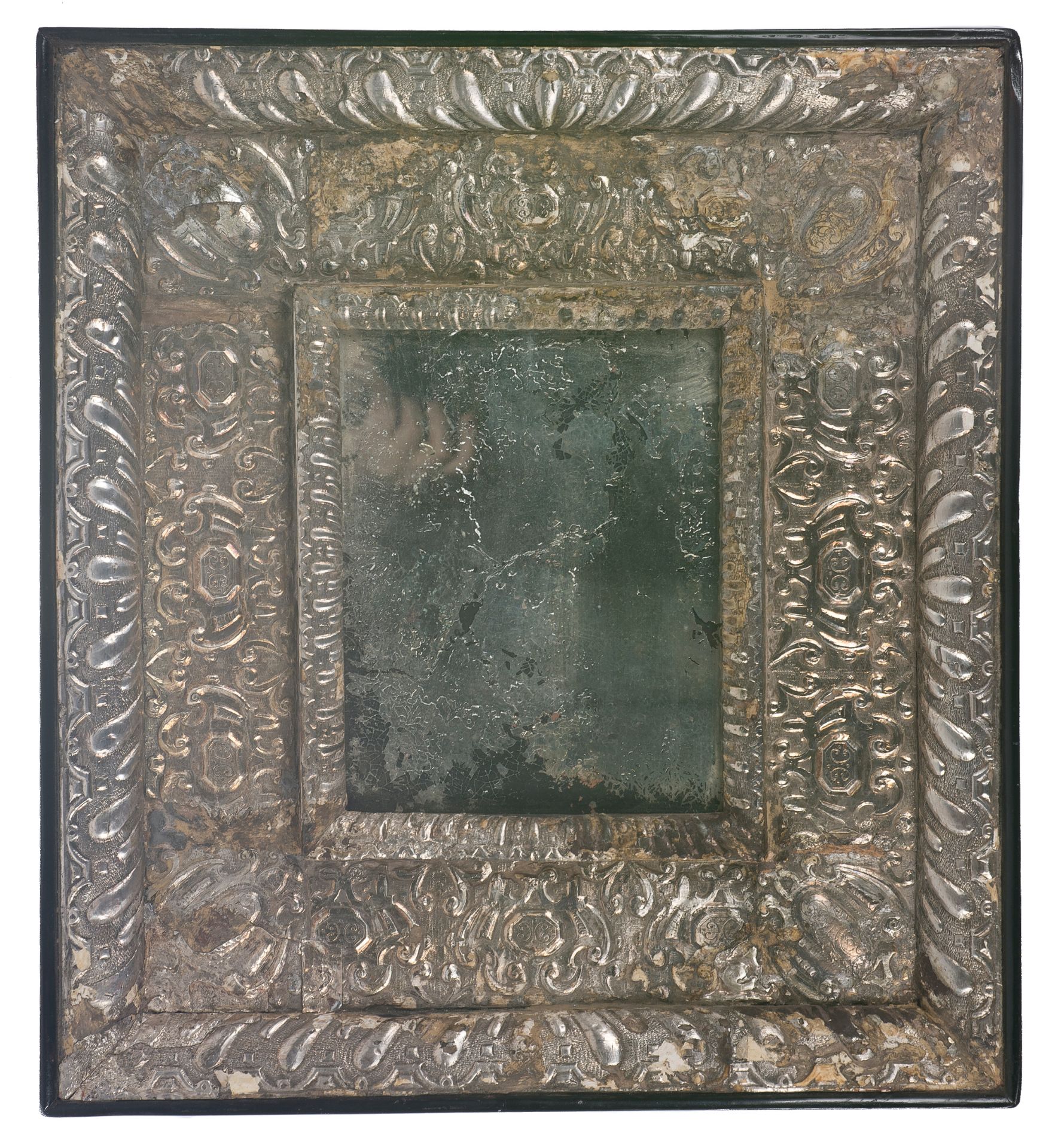 Mirror with wooden frame covered in embossed silver mirror. Colonial. Peru. Mid 17th century.