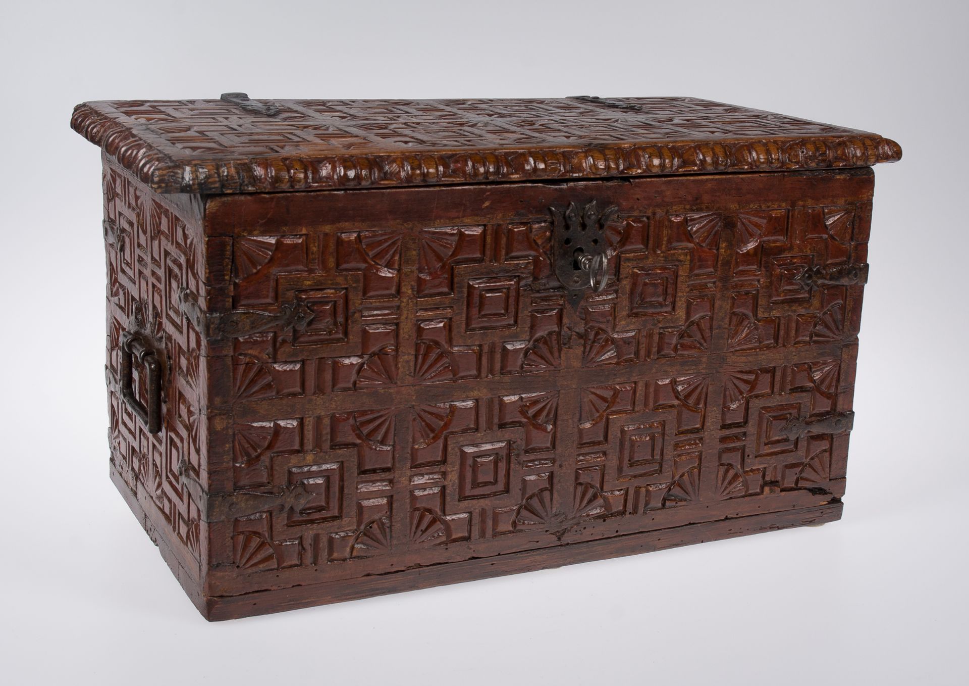 Carved cedarwood chest with iron fittings and polychrome residue. Colonial School. Peru. Late 17th