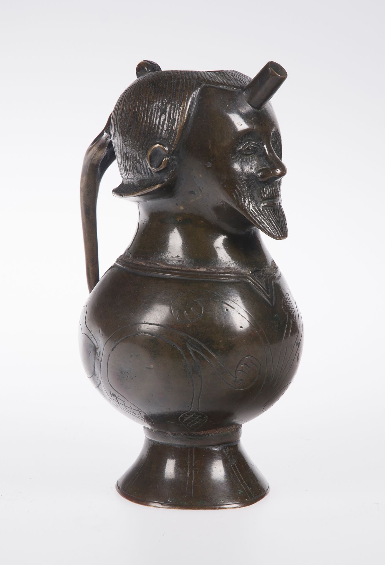 Human shaped bronze pitcher with gilt residue. German. Possibly 19th century.