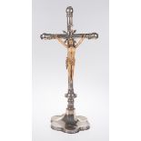 Large cross made of chased and pierced cast silver. Barcelona. 16th century. Sculpted ivory Chris