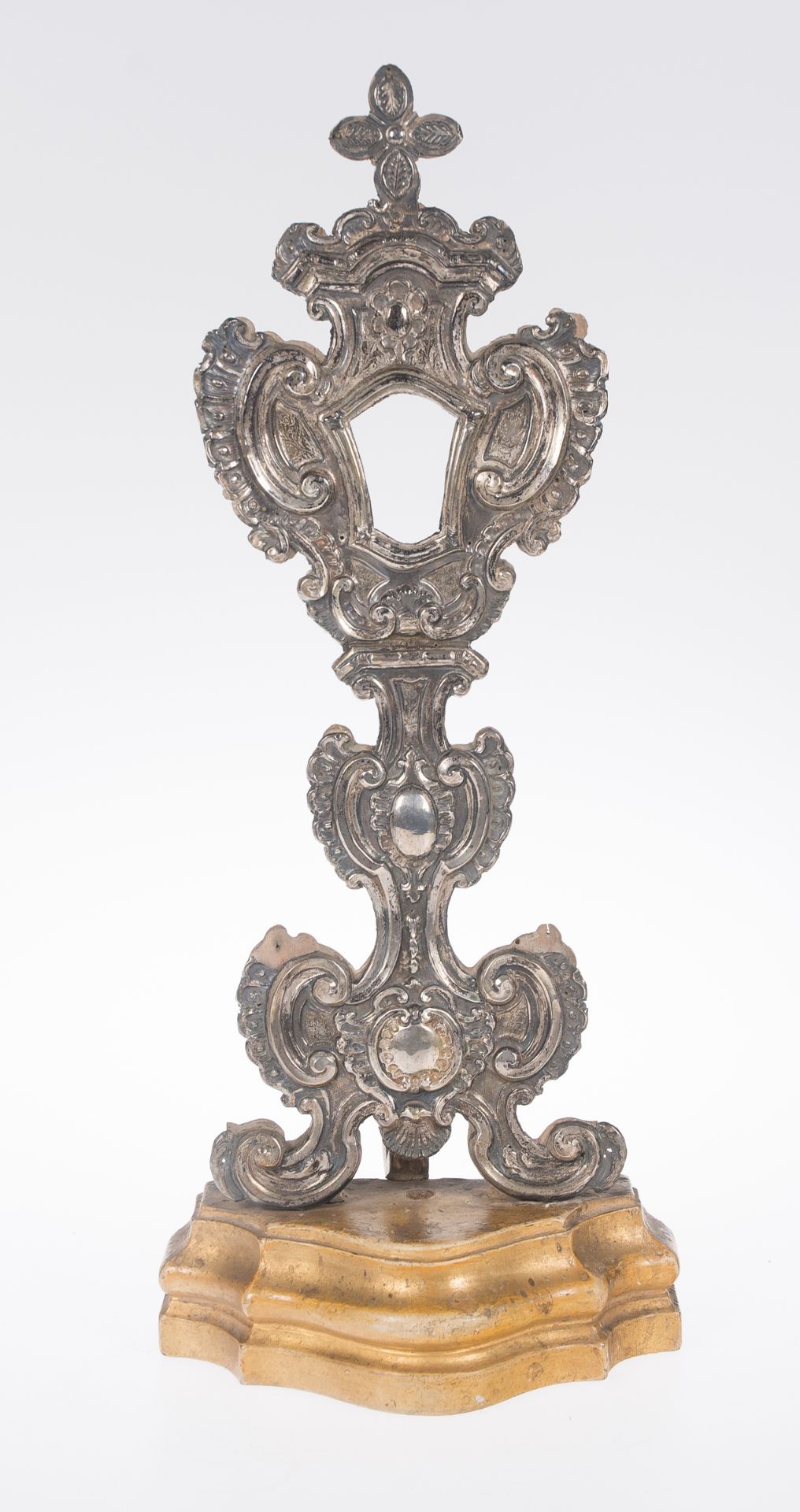 Wooden reliquary covered in embossed and chased silver. Italy. 17th - 18th century.