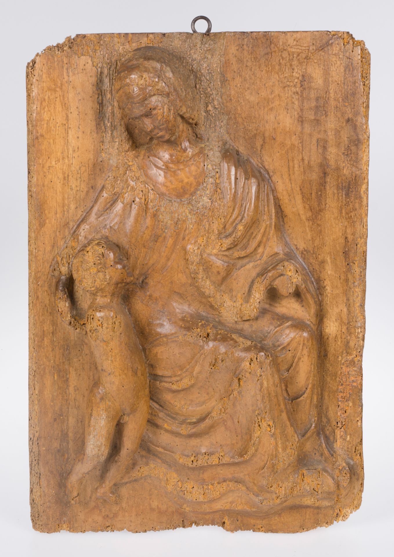 "Madonna and Child". Carved wooden relief. Italian School. 14th century.