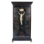 Ebonised wooden shrine with painted glass panes and an ivory Christ. Italy. 17th century.