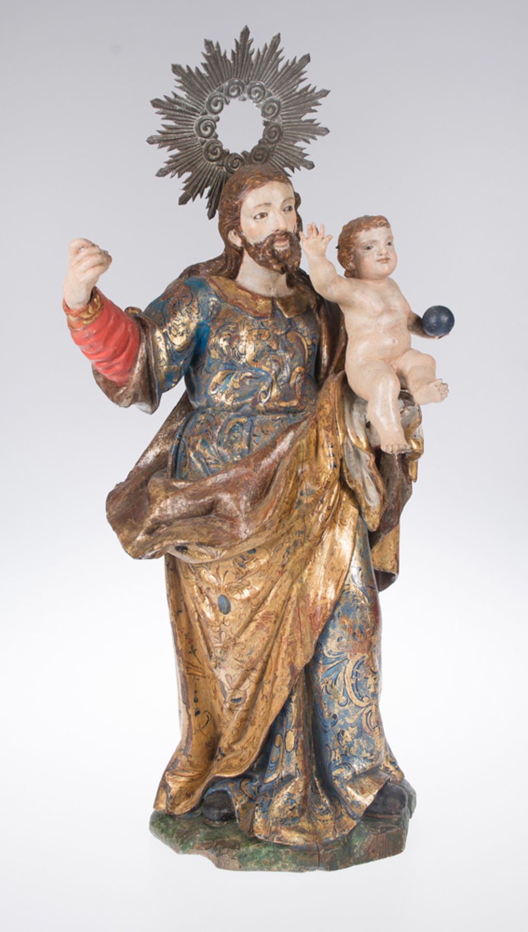 "Saint Joseph with the Christ Child". Carved, gilded and polychromed wooden sculpture. Spanish Scho