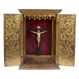Carved, gilded and polychromed wooden altar with a sculpted ivory Christ. 18th century.