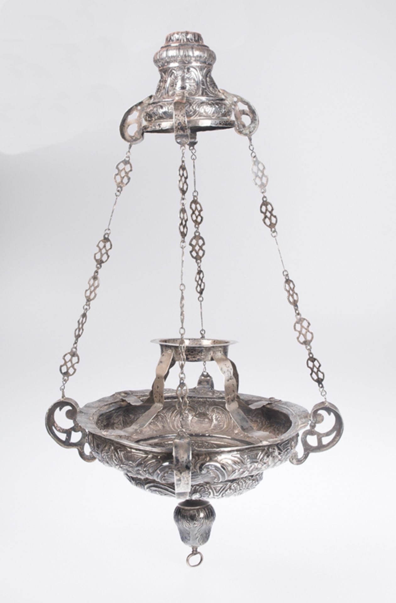 Embossed and chased silver votive lamp. 17th - 18th century.Embossed and chased silver votive