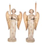 Exceptional pair of carved, polychromed and gilded poplar wood torch bearing angels. Tuscany,