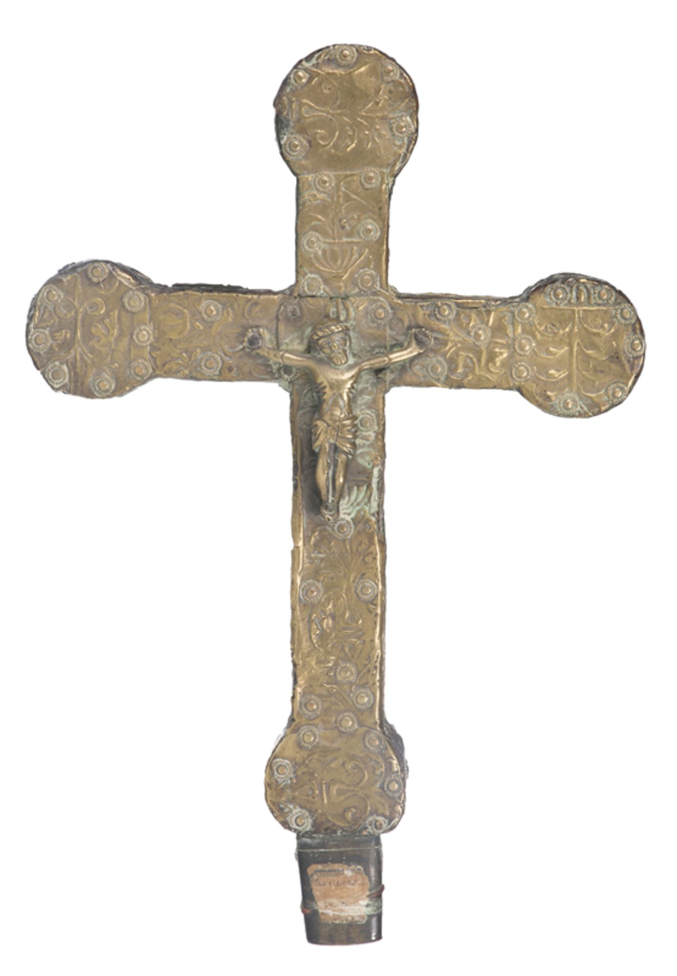 Embossed and hammered gilded copper processional cross, with an appliqué figure of Christ. La