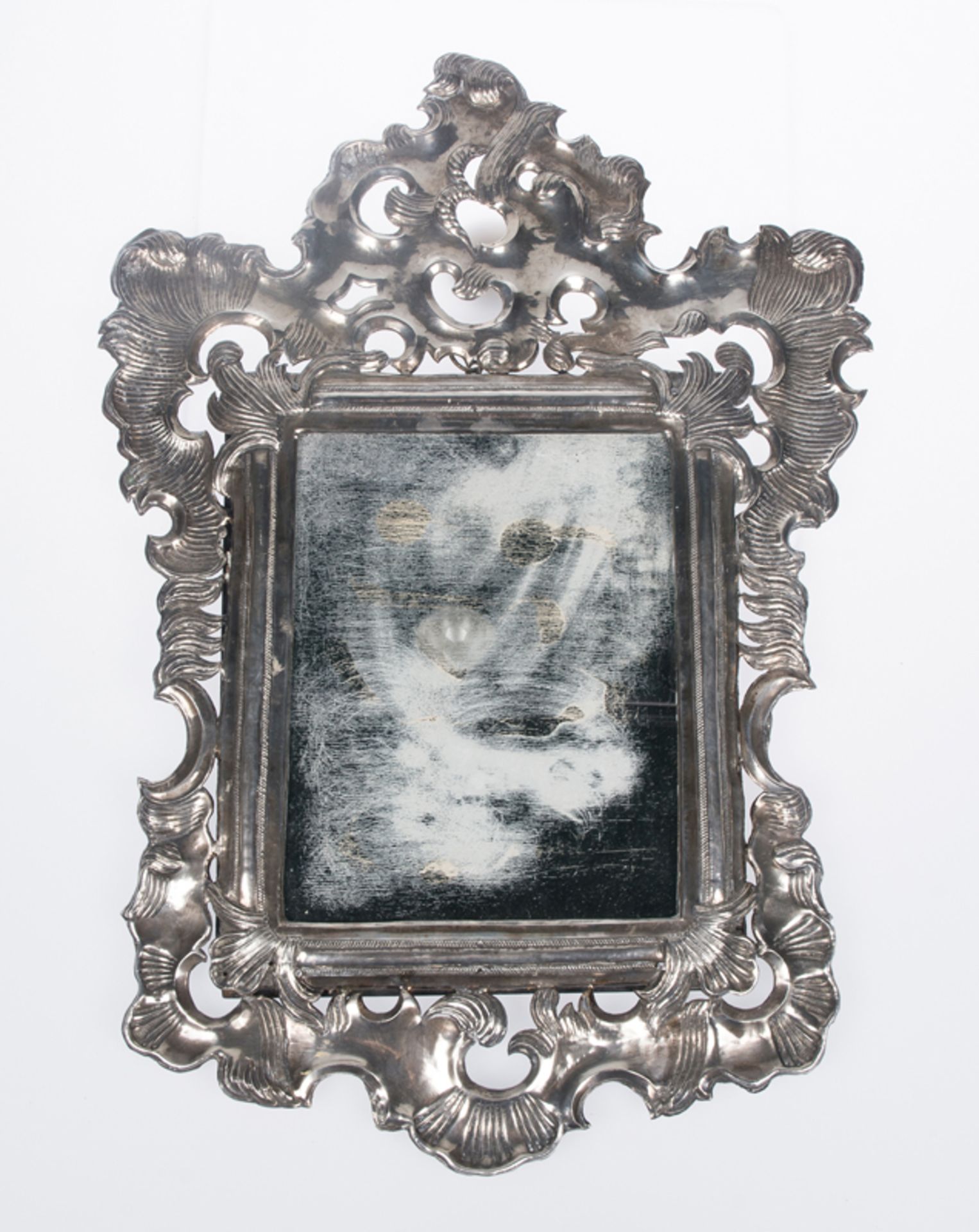 Embossed silver mirror. Spain. 18th century.Embossed silver mirror. Spain. 18th century. With