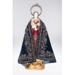 Marvellous polychromed ivory and wood dressed virgin, with garments. Hispanic-Philippine. 17th