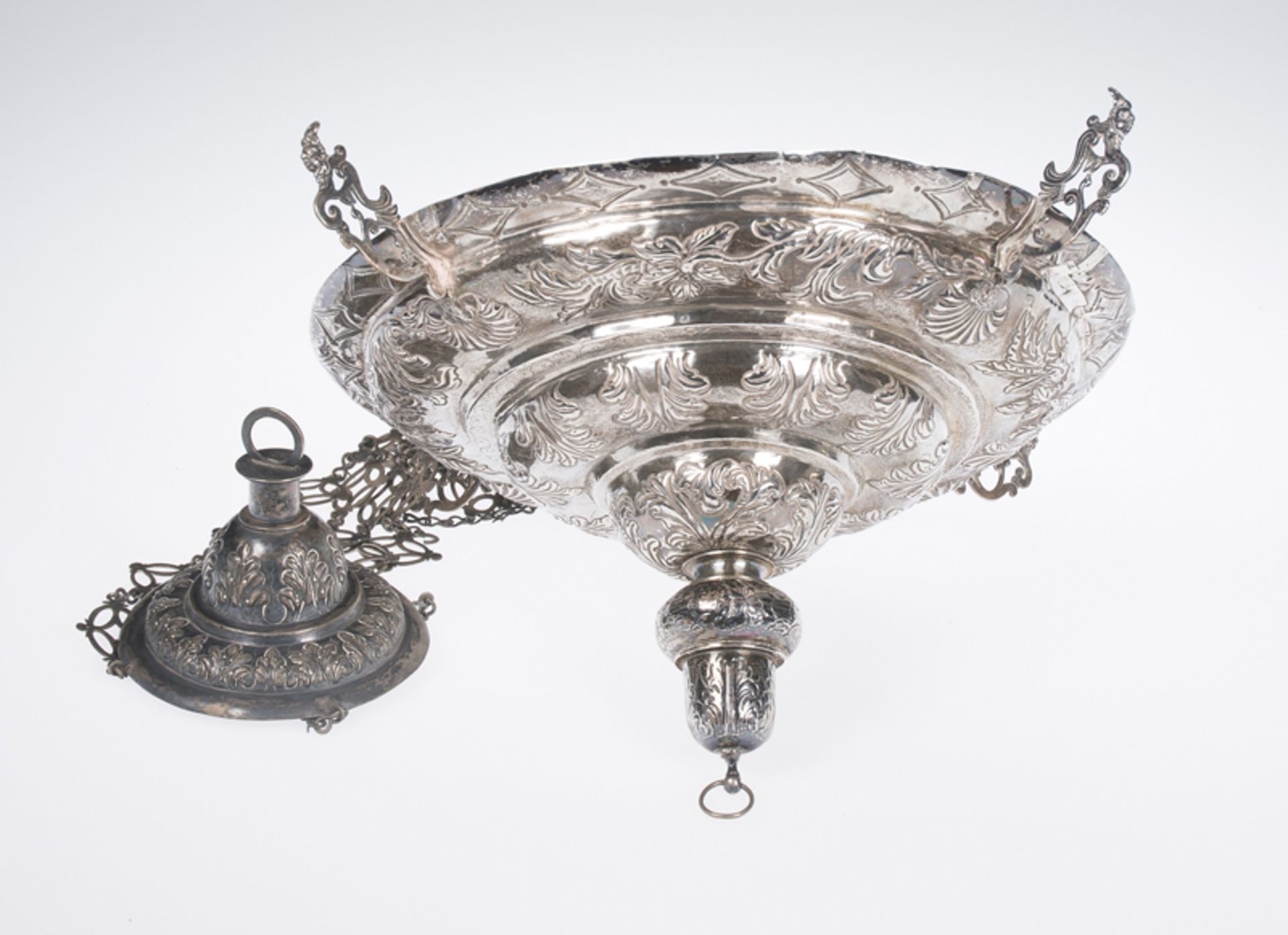 Embossed and chased silver votive lamp. 17th - 18th century.Embossed and chased silver votive