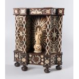 Imposing cedarwood altar with bone marquetry and a sculpted and gilded ivory Virgin Mary. Colonial