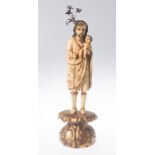 "Saint Joseph and the Child". Sculpted and gilded ivory figure. Hispanic-Philippine. 17th - 18th cen