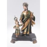 "Saint Joseph and the Child". Carved, polychromed and gilded wooden sculptural group. Colonial. Pos