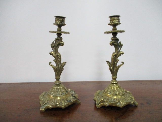 Pair of early 20th century brass candlesticks very ornate. H23 x W11cms