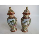 Pair of Chinese style lidded urns 36cm high