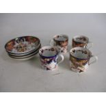 Set of 4 Imari style cups and saucers.