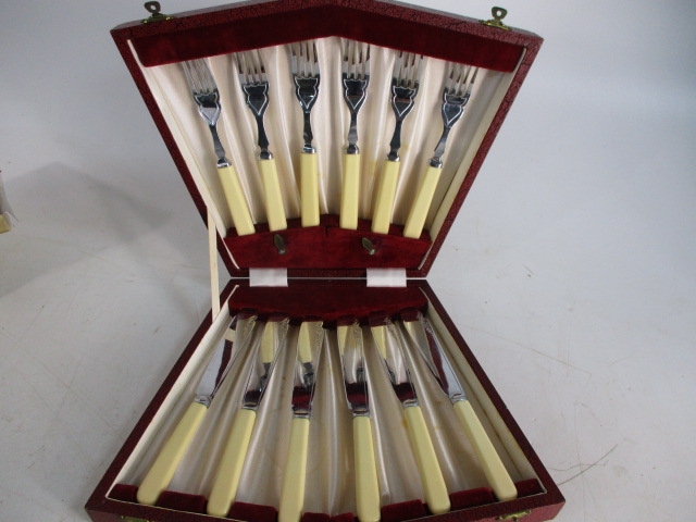 Vintage set Sheffield fish knives and forks in case.