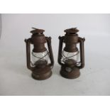 Pair of vintage tilly lamps.