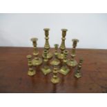 Collection of 20th century brass miniature candle sticks, from 7cms to 12cms height.