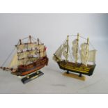 Vintage wooden model sailing ships H.M.S. Bounty and one other