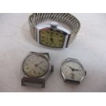 Trio of antique watch faces and wrist watch, J.W. Benson, Hirco and Ingraham (needs attention).