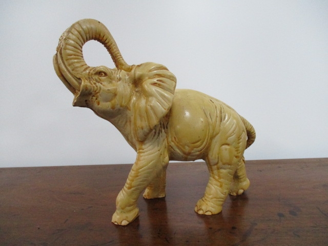 Resin elephant decoration. H26 x L28 x W15cms.