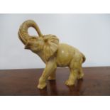 Resin elephant decoration. H26 x L28 x W15cms.