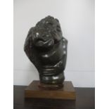 Shona Art - a Fabian Madamombe carved stone sculpture depicting a mother and child, raised on a