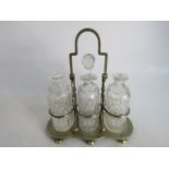 William Briggs & Co (S) Tantalus with 3 glass decanters missing 2 stoppers