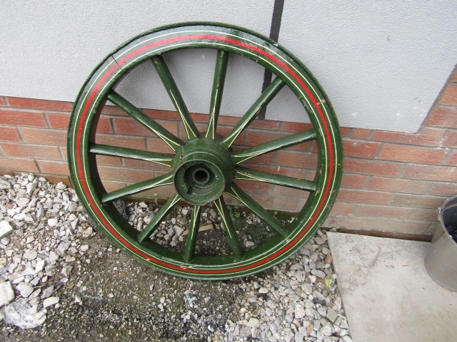 Antique wooden wheel wooden so]pokes with steel tread painted in showman style