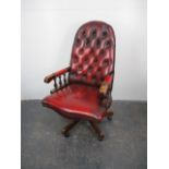 Vintage chesterfield style captains swivel chair in oxblood Red