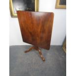 19th century mahogany tilt top table ceramic castors