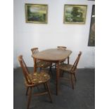 Mid century table and Ercol style stick back chairs, table size L122 x H74 x W76