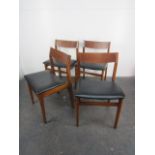 Set of 4 mid century Danish style dining chairs with vinyl covered base.