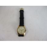 Vintage 1950's gold plated 15 jewel men's wrist watch, leather strap.