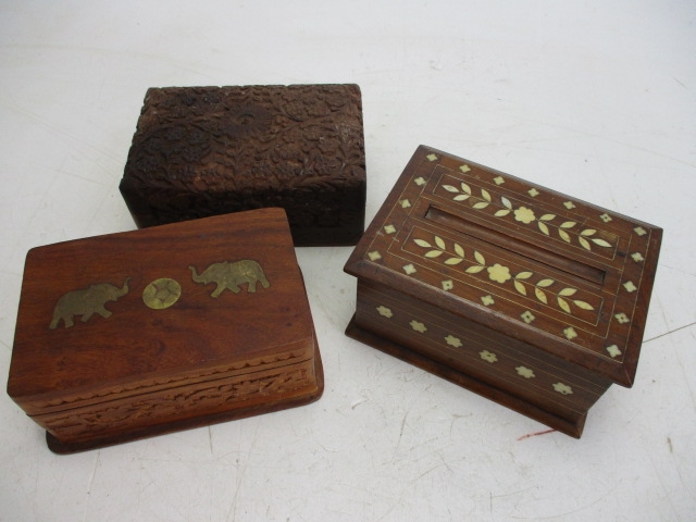 Trio of wooden carved trinket/storage boxes to include, brass inlaid & cigarette box.