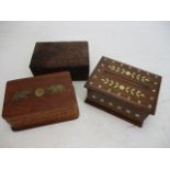 Trio of wooden carved trinket/storage boxes to include, brass inlaid & cigarette box.