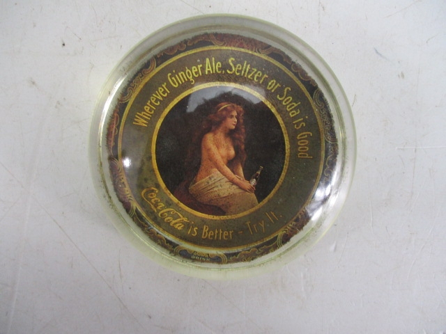 Vintage semi naked ""The nude"" Coca Cola advertising glass paperweight.