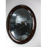 Victorian oval bevelled edge mirror, H72 x W57.
