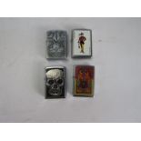Selection of vintage Zippo lighters .